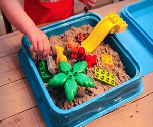 Lego plus sand means a fun sensory bin!