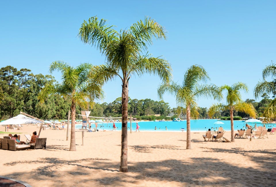 The man-made lagoons are surrounded by a beach-like setting.