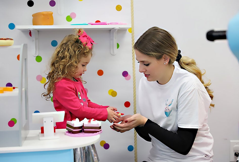 Have a slice of cake in the kitchen at A latte Fun. Photo by Russ Miskiewicz