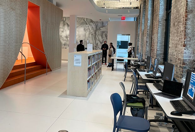 Exposed brick and open walkways at the Adams Street Library