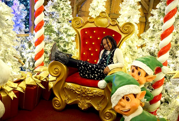 American Christmas in Mount Vernon: Posing in Santa's chair