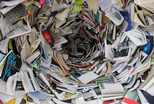 Image of a massive pile of books and papers awaiting recycling.