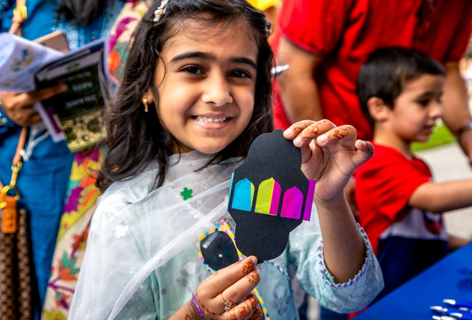Celebrate the Festival of Eid. Photo of girl celebrating by Chris Dunn, courtesy of Asia Society Texas