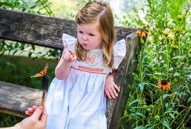 girl in a butterfly garden