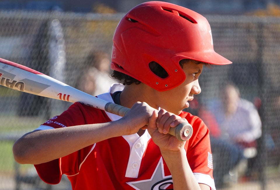 Little boy at bat. Photo by Jodi Mercier for Mommy Poppins