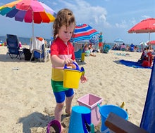 A pile of buckets goes a long way with young kids at the beach. 