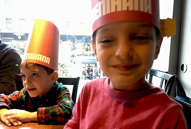 Two boys wear Benihana hats and enjoy a family-friendly New Jersey restaurant