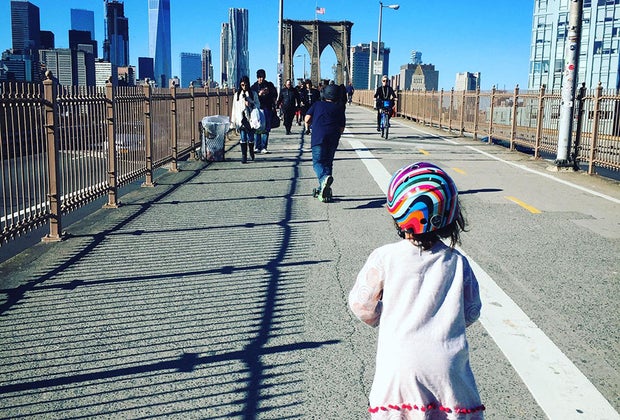 Girl scoots across the Brooklyn Bridge