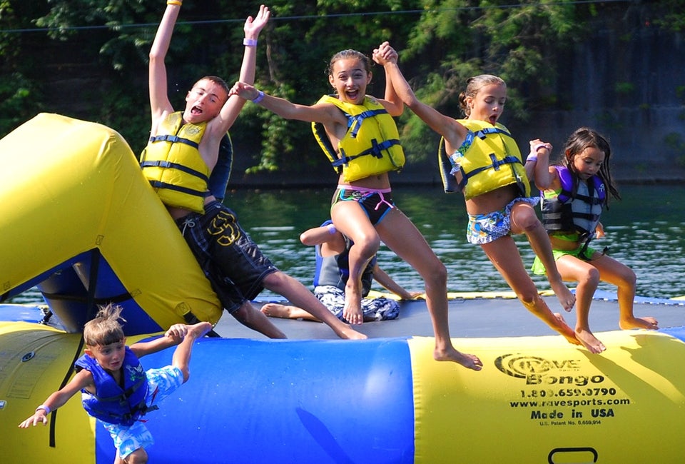 Bounce, splash, and make the most of summer at the best inflatable water parks in New England. Photo courtesy of Brownstone Adventure Sports Park