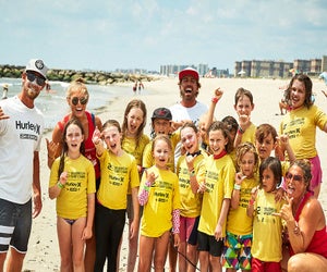 Give your kids a chance to learn to surf this summer at Skudin Surf Camp & Lessons. Photo courtesy of Skudin Surf 