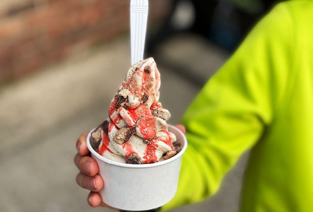 holding a soft serve with toppings at Milky Ways