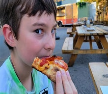 It doesn't get much better than a delicious slice of pizza! Photo courtesy of Stracci Pizza