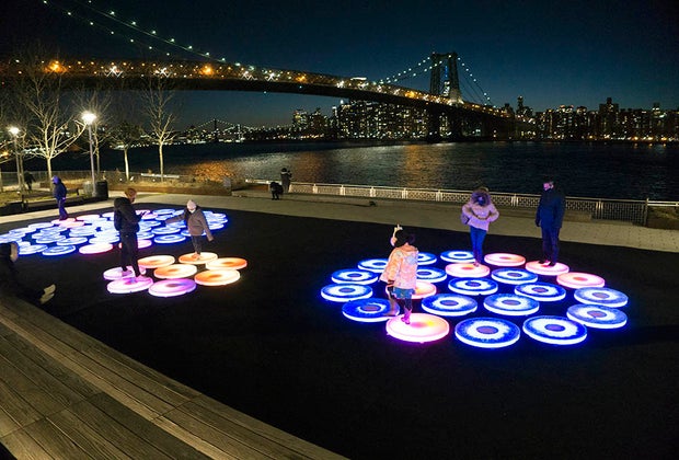 wide shot Manhattan skyline Reflect, Domino Park's New Light-up Public Art Installation