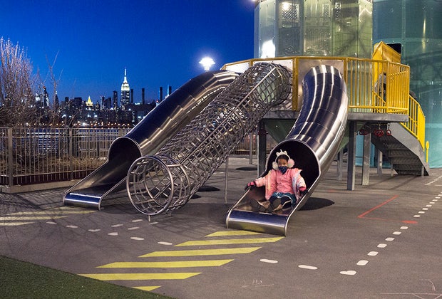 Girl on slide at domino park