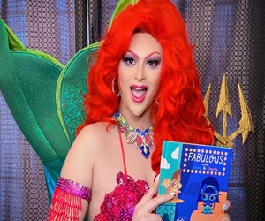 Mermaid Queen Bella Noche reads a story at the library. Photo courtesy of Drag Queen Story Hour