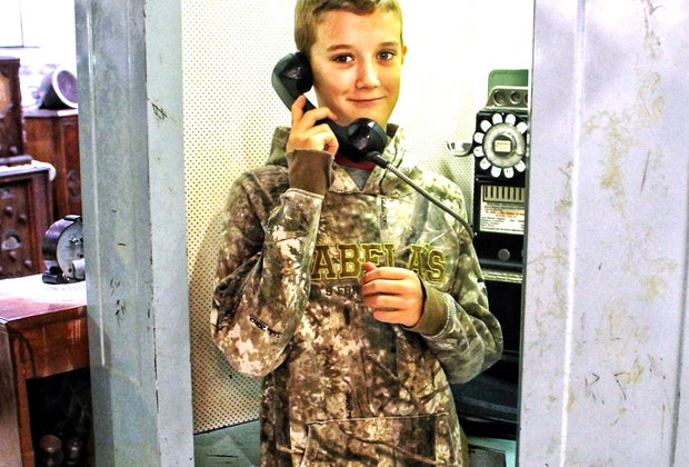 Photo of a child on a telephone - End of Summer Bucket List