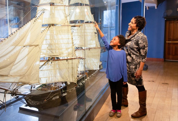 Image of mother and child with model ship - Christmas Vacation in Boston