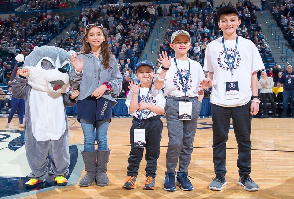 College sports in Connecticut put family fun front and center! Photo by Stephen Slade, courtesy of the University of Connecticut Athletics