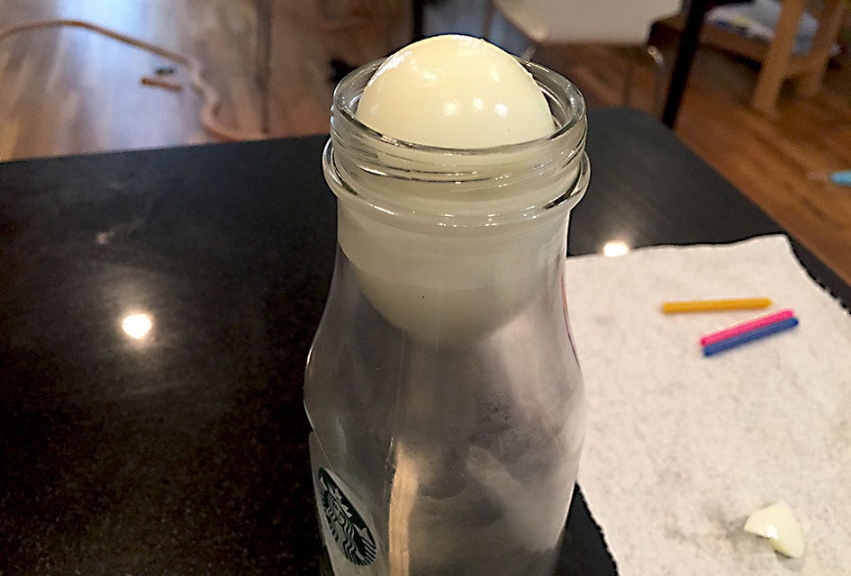Watch as the egg slides into the bottle!