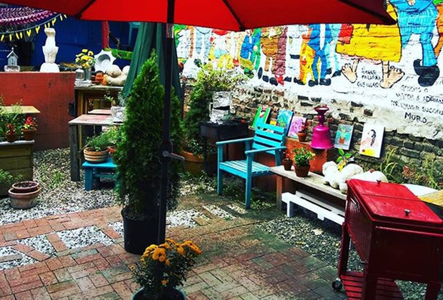 Enjoy outdoor dining in El Kallejon's backyard