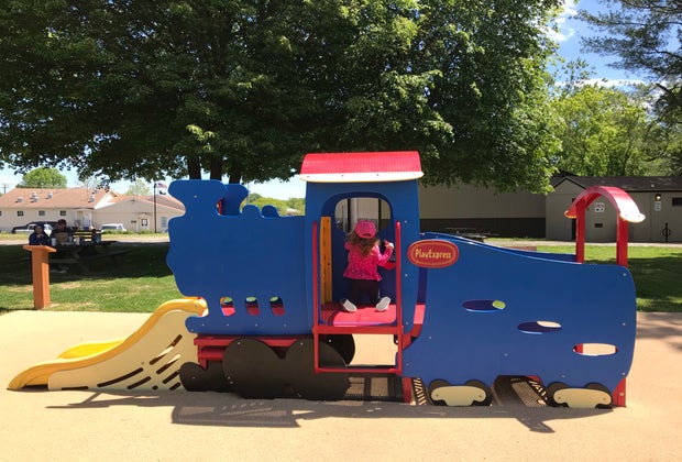 South Jersey Playgrounds girl on toy train structure