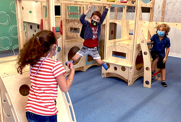 Conquer the monkey bars during a private play sessionat Exceptional Explorers