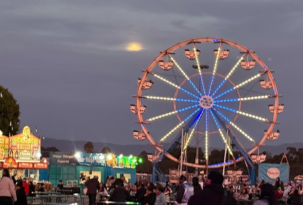 The view from the Ferris wheel, with the moon rising, is stunning at Winterfest OC.