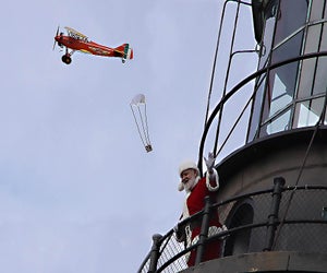 Relive this historic event with the Fire Island Lighthouse Preservation Society when Santa arrives at the Fire Island Lighthouse. Photo courtesy of the NPS