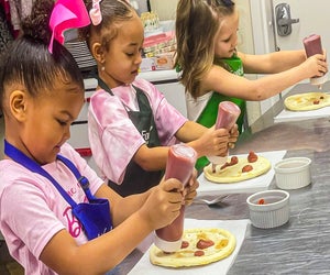 Kids of all ages get involved with cooking classes. Photo courtesy of Foodology Cooking School