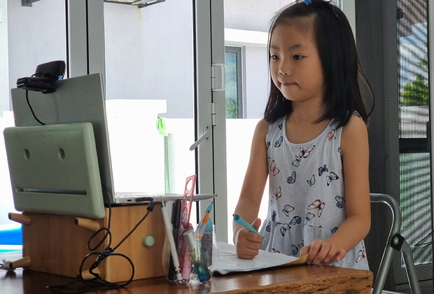 The Best Free Online Summer Camps for Kids in 2025 Girl at computer