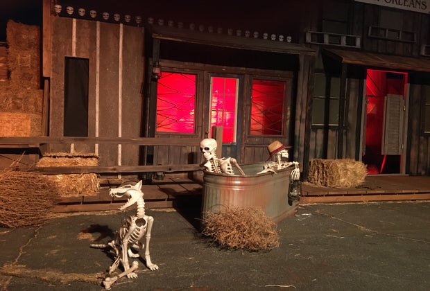 Skeletons in a bathtub at Hauntoween drive-through