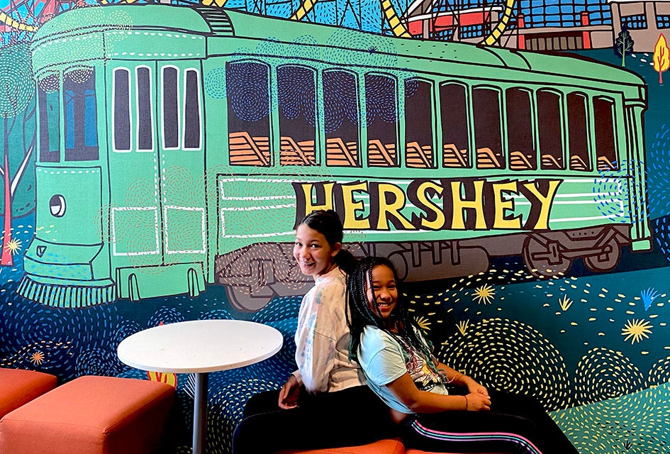 Pose for a post-card worthy photo in front of the Hershey-themed mural at Tru by Hilton Hershey Chocolate Avenue during your stay. 
