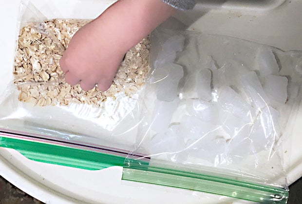 Turn a Highchair into a Baby Activity Center: Oatmeal and ice make sensory bags.