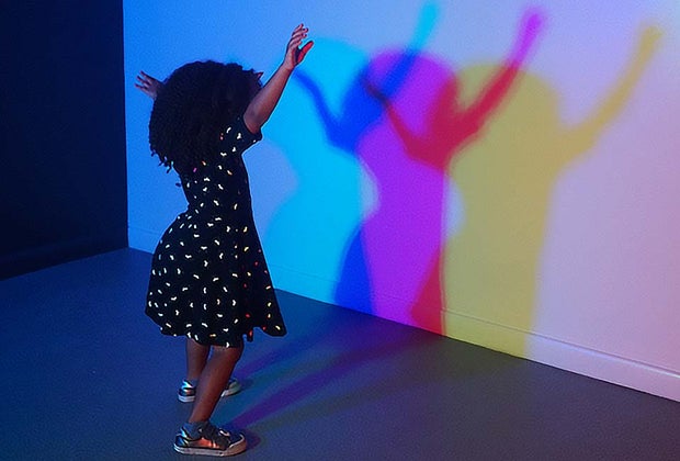 Ways to Keep Cool in a Heat Wave in Philly girl at shadow wall