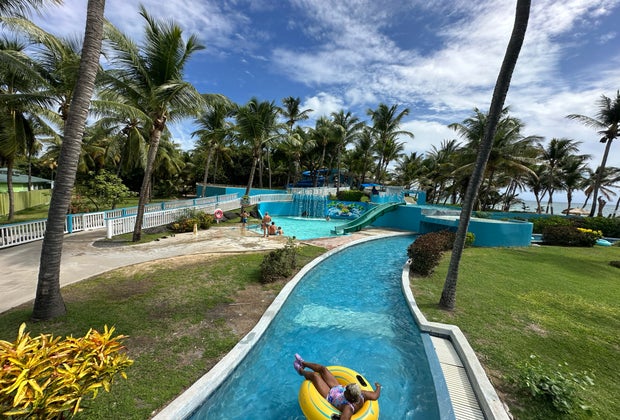 Kids can go down the water slides while parents float along the lazy river at Coconut Bay Beach Resort.