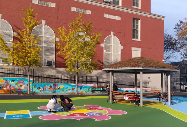 PS 197 playground renovation: Kids playing on the colorful turf