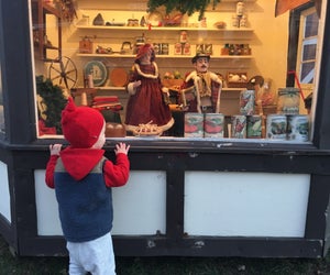 The viewing windows at Dickens Village in Maplewood are just the right height for little visitors. Photo by Rose Gordon Sala