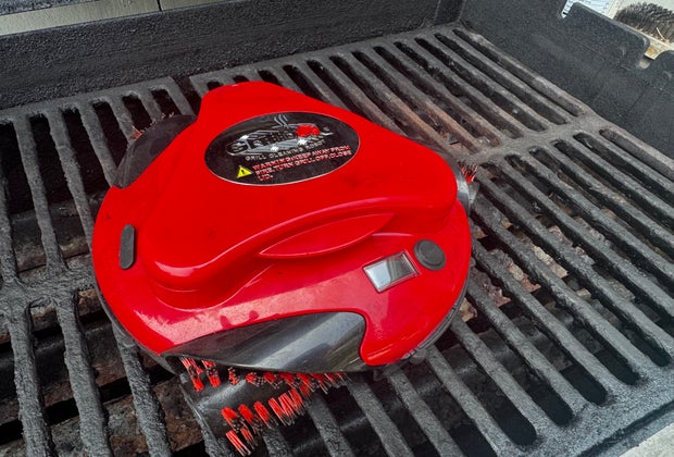 The Grillbot at work on a dirty grill.