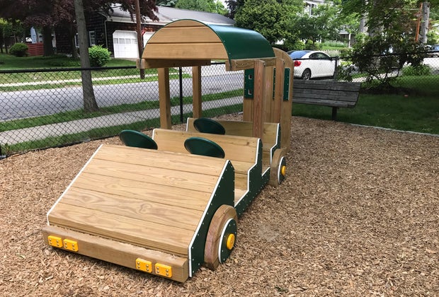 Go for a ride in the toddler-friendly playground at Sunset Park
