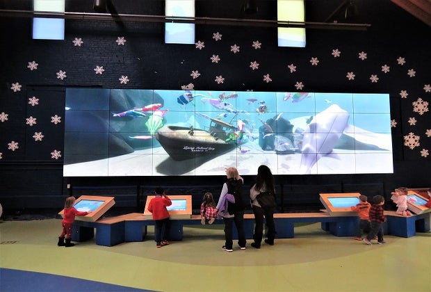 Photo of children at interactive station in Maritime Aquarium.