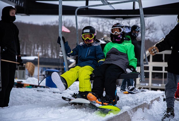 Big Boulder/Jack Frost snowboarders taking the chair lift Best Snowboarding NYC