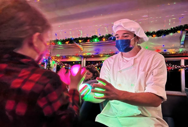 Performers personalize The Polar Express journey, taking time to stop and visit with children and ensuring everyone has a good time.