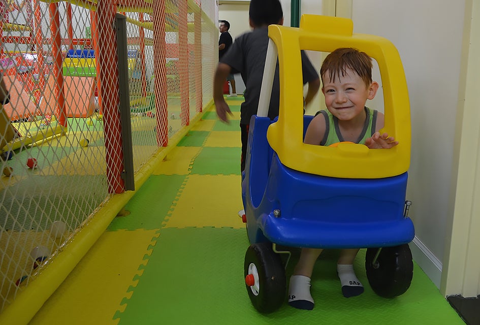 Toys and pretend-play items encourage screen-free play. 