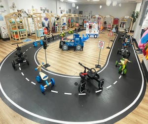 Kids can hop on tricycles and ride around the indoor track at L.I. Salty Kids Cove. 