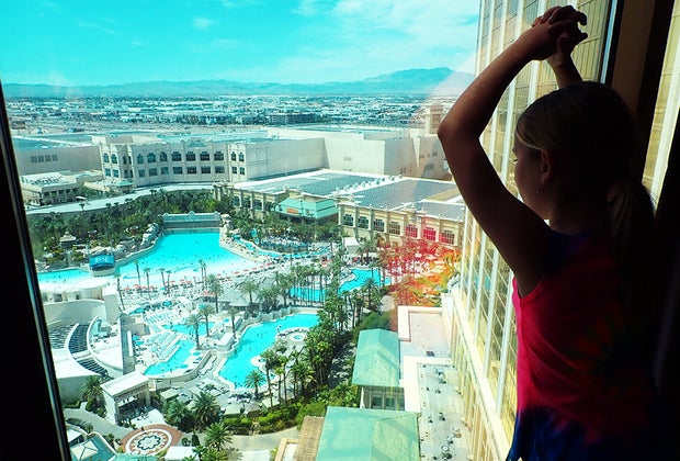 girl looking out the window at Mandalay Bay