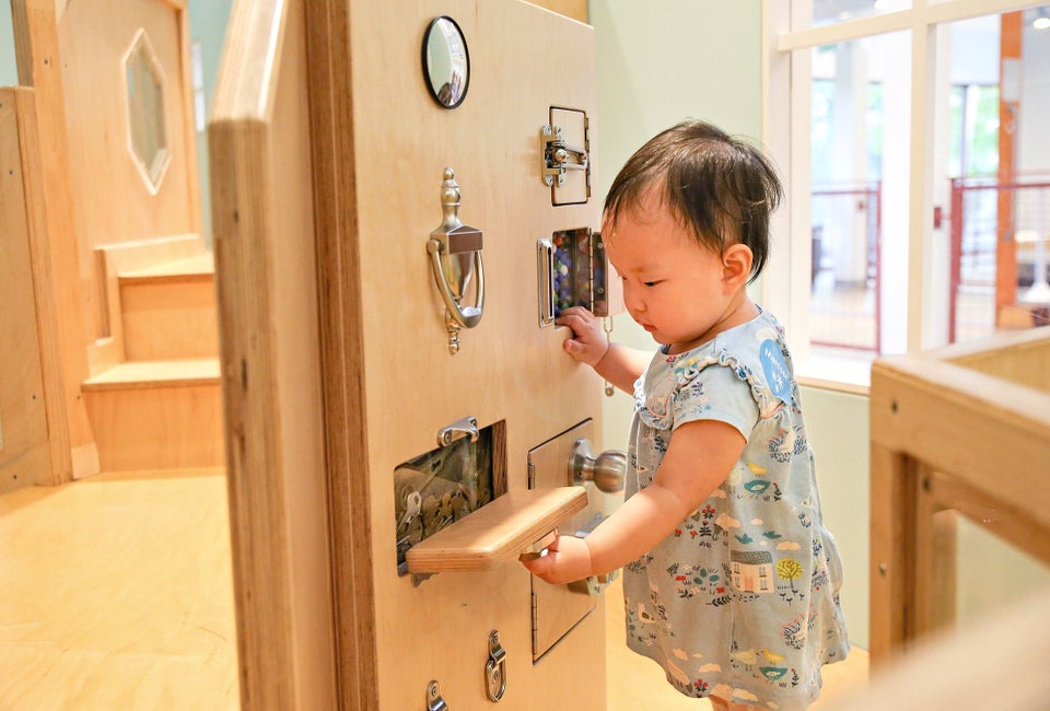 Discover the Latch Wall in the Brain Building Together space for 0-3 year olds. Photo courtesy of Discovery Museum