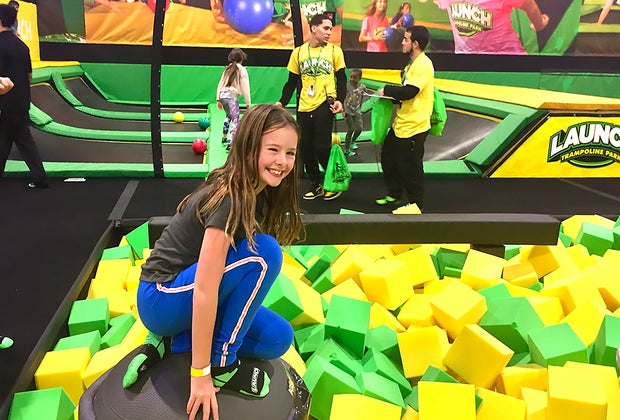 Girl jumping in a foam pit at Launch Trampoline Park in NYC