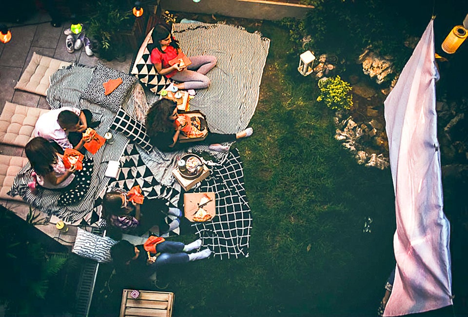 Everything you need (at every price point) for a perfect backyard movie night! Photo courtesy of Canva