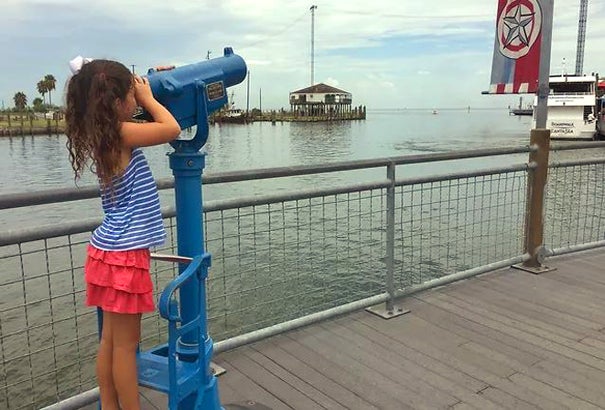 Coin-operated telescopes line Kemah's boardwalk.