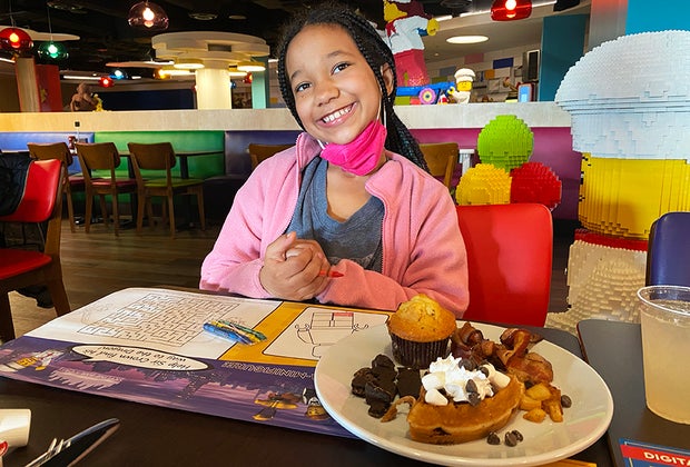 girl eating breakfast at legoland restaurant
